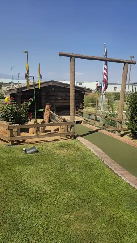 Mini golf hole with pin flag